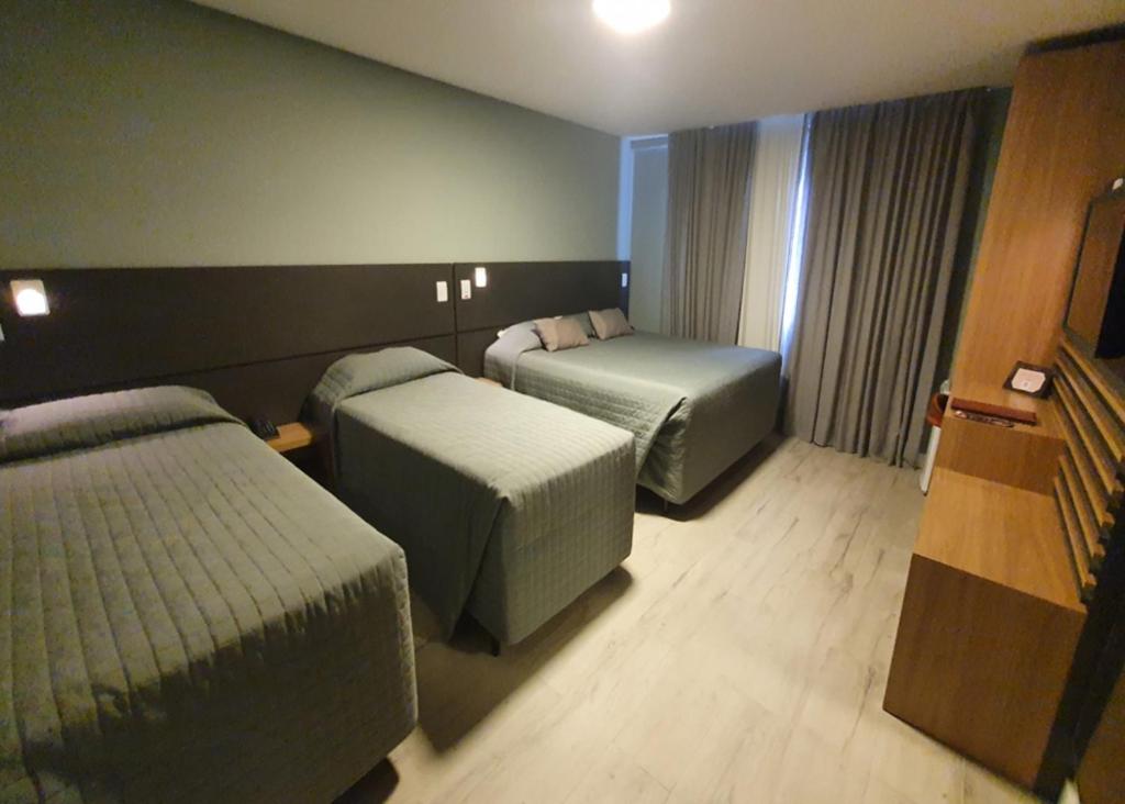 Luxo Quádruplo com Varanda - Sky Palace Hotel